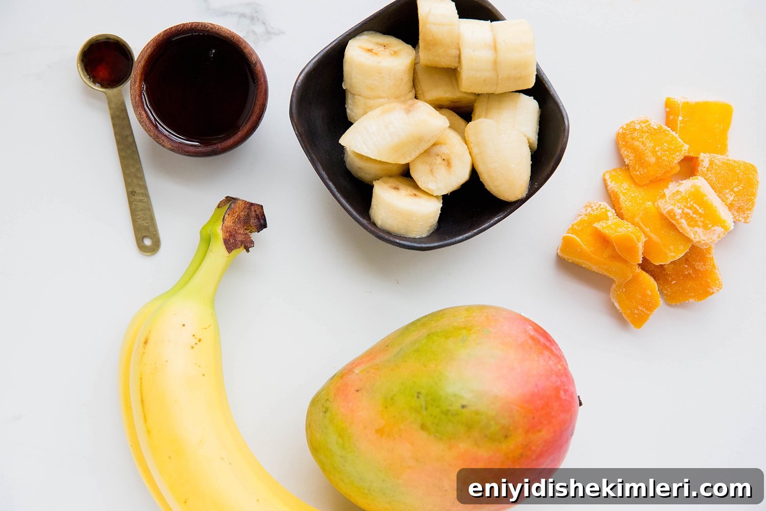 Mango Banana Nice Cream Recipe — Creamy Dairy-Free Mango Banana Dessert 3 Frozen banana and mango pieces in a bowl